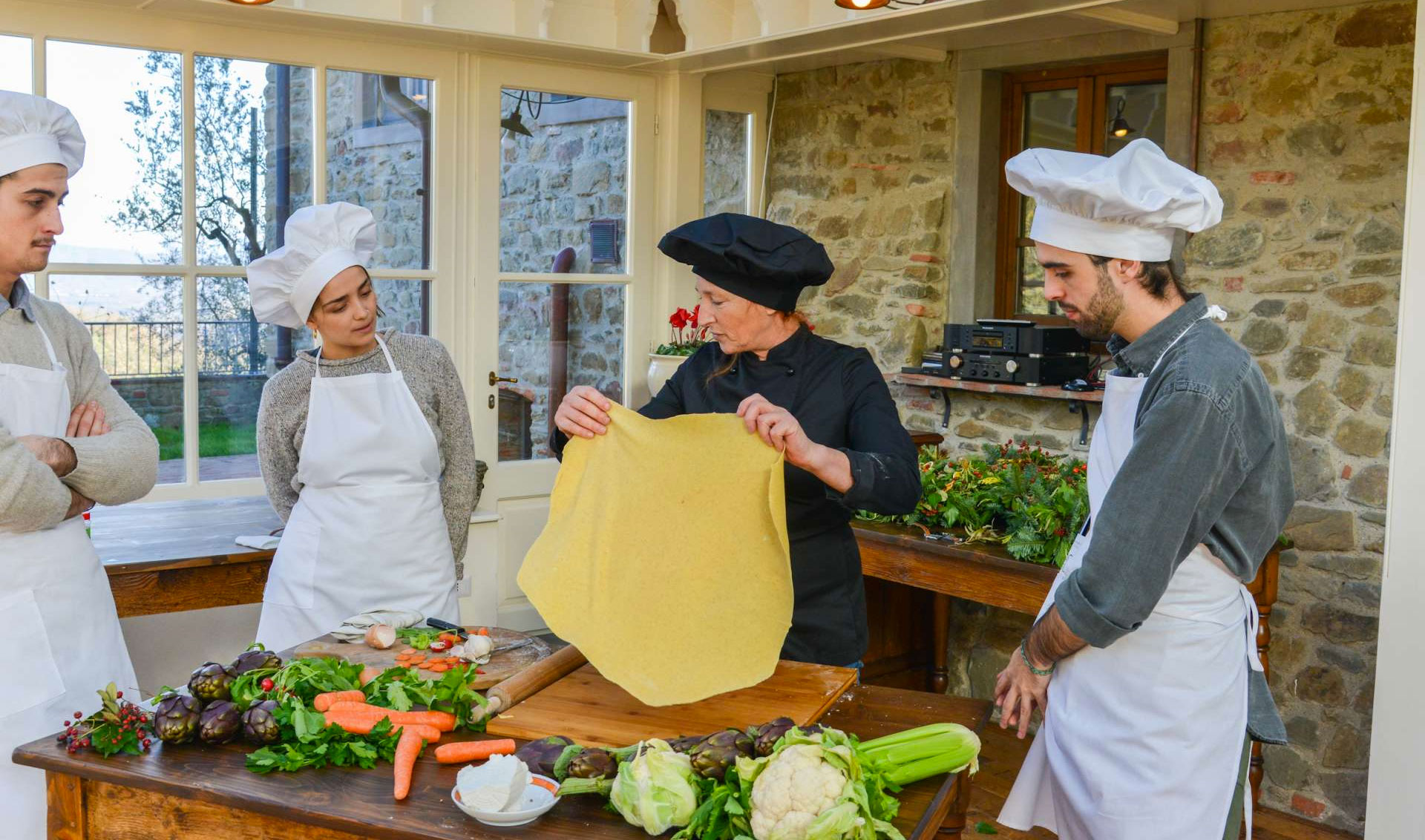 Inviting culinary classroom with fresh ingredients, prepared dishes, and a well-equipped cooking station