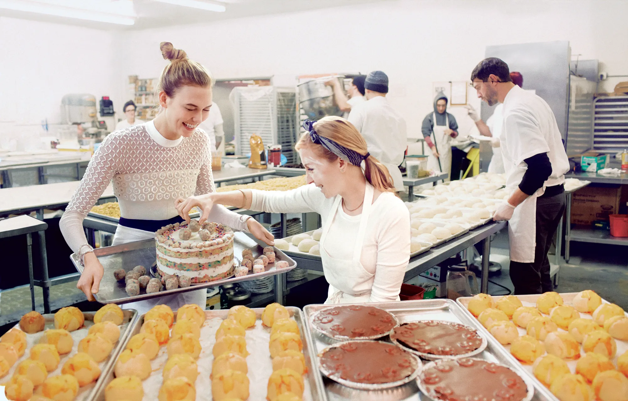 Cooking instructor guiding participants through a recipe preparation and culinary technique demonstration